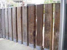 a close up of a fence made out of wood