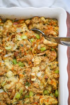 a casserole dish with meat and vegetables in it, ready to be eaten