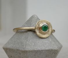 Vintage style gold ring with tiny green emerald stone 14K Gold ring Yellow gold Birthstone ring, Solid gold ring, Organic shape ring This dainty 14k Gold stackable Ring is made from 14k solid gold (you can choose 14k or 9k) it has an organic circle disc shape and features a green emerald gemstone that is bezel set in the center, Emerald is the birthstone for May, they are considered to be a symbol of rebirth and love. Delicate and minimalist, an excellent choice for anniversary gift, promise rin Gold Emerald Ring With Round Band, Gold Emerald Ring For May Birthstone With Round Band, 14k Gold Emerald Ring With Round Band, Gold Rings Stackable, Emerald Stone, Solid Gold Rings, Emerald Gemstone, 14k Gold Ring, Birthstone Ring