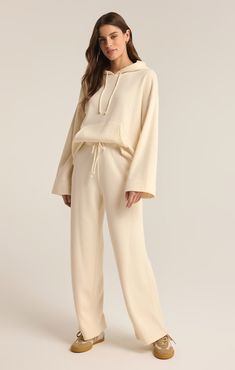 Cozy up in our long sleeve drawstring hoodie, crafted from plush Reverse Cozy knit fabric for ultimate comfort. Featuring wide sleeve openings and a handy kangaroo pocket, this laid-back essential is perfect for effortless, everyday style. Taylor Swift Dress, Women Lifting, Maxi Jumpsuit, Athleisure Tops, Silk Bottoms, Lift Off, Hoodie Set, Leather Denim, Versatile Outfits