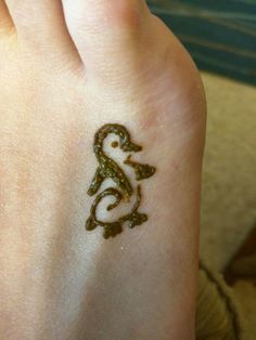 a small tattoo on the foot of a person