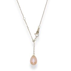 This exquisite necklace features a rare, natural pink pearl in a soft cherry blossom hue, elegantly suspended on a sleek sterling silver chain. The adjustable clasp offers personalized length options, ensuring it complements any neckline and style effortlessly. Pair it with the matching pink pearl earrings to create a cohesive, sophisticated look that’s perfect for any occasion. A perfect blend of timeless elegance and modern versatility, this necklace is a must-have for any jewelry collection. Composition: Sterling Silver/Natural Freshwater Pearls Avoid exposing your silver jewelry to harsh chemicals such as perfumes, hair sprays, and cleaning products. These can cause discoloration and damage to your jewelry.  Store your silver jewelry in a cool, dry place, away from direct sunlight. Exp Pink Pearl Earrings, Pink Pearls, Soft Feminine, Forever Jewelry, Pearl Pendant Necklace, Pink Pearl, Watch Necklace, Sterling Silver Necklace, Pearl Pendant