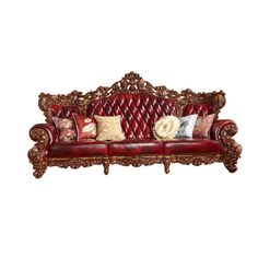 a red leather couch with pillows on it's back and arm rests against a white background