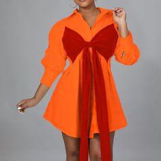 Orange Long Sleeve Patchwork Dresses, Red Long Sleeve Dress With Splicing, Orange Spliced Dresses For Spring, Spliced Mini Dress For Fall Parties, Fall Party Mini Dress With Splicing Details, Fall Party Mini Dress With Splicing, Long Sleeve Spliced Mini Dress For Party, Knee-length Mini Dress With Patchwork For Party, Party Knee-length Mini Dress With Patchwork