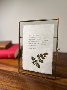 a piece of paper that has been placed in a frame on top of a table