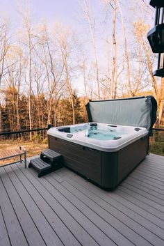 a hot tub sitting on top of a wooden deck