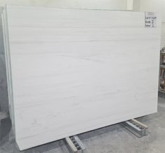 a large white marble slab in a warehouse