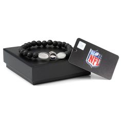 the nfl bracelet is on display with a card holder and black beaded bracelets