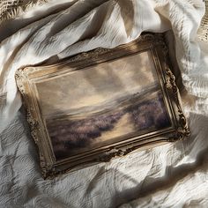 an old painting is laying on the bed