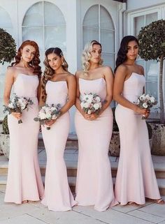 the bridesmaids are all wearing different styles of pink dresses and bouquets in their hands