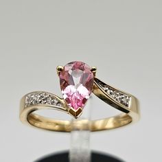 Vintage 14k Yellow Gold Pear Cut Coated Pink Topaz and Diamond Ring  Size 6.75 Item w#495 Clean and in good condition  0.89ct pink topaz (Treated and Coated to enhance the color) 0.03 carat total weight natural diamonds 3 grams Ring can be sized by your local jeweler Welcome to Westgate Jewels! At Westgate Jewels, we specialize in vintage estate jewelry, vintage designer jewelry, Vintage Native American jewelry and wears, Collectables, and Vintage fine karat gold and sterling silver jewelry. Our Pink Pear-shaped Gemstone Rings, Fine Jewelry Pear-shaped Topaz Ring For Anniversary, Pear-shaped Topaz Ring For Anniversary, Fine Jewelry, Pear Shaped Pink Ring For Formal Occasions, Pink Pear-shaped Ring For Formal Occasions, Pear-shaped Topaz Ring For Anniversary, Pink Pear-shaped Formal Rings, Formal Pink Pear-shaped Rings, Topaz And Diamond Ring