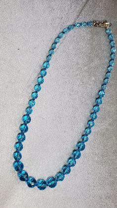 The beautiful quality of the necklace is evident in the materials. Czech Fire Polished beads, Swarovski crystals, and silver plated secure clasp. Love the intense aqua! Formal Blue Single Strand Beaded Necklace, Blue Crystal Jewelry With Gemstone Beads, Blue Gemstone Beads Necklaces For Party, Blue Gemstone Beads Necklace For Party, Faceted Crystal Round Necklaces For Party, Faceted Crystal Necklaces For Party, Faceted Crystal Necklace For Party, Blue Beaded Necklaces With Faceted Round Beads, Formal Blue Faceted Necklaces