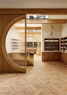 the inside of a store with wooden floors and shelves