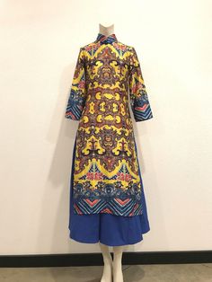 A Beautiful Silk Ao Dai Dress. The colors and print of the fabric are just gorgeous! Fully lined. Zips up the back. A beautiful statement piece. Condition: Excellent-pre-owned. Please see pictures. Lay flat measurements: Shoulder to shoulder: 13.5 inches. Armpit to armpit: 17 inches. Waist: 15 inches. Hips: 18 inches. Length: 5 inches. Arm inseam: 12 inches. Mahalo, Christina Multicolor Silk A-line Maxi Dress, Silk Fitted Dress With Printed Motifs, Fitted Silk Dress With Printed Motifs, Blue Silk Dress With Printed Motifs, Multicolor Silk Dresses With Printed Motifs, Multicolor Silk Dresses With Vibrant Print, Blue Maxi Dresses With Digital Print, Blue Maxi Dress With Digital Print, Multicolor Digital Print Maxi Dress