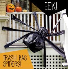 a black plastic bag sitting on top of a white porch next to a halloween spider