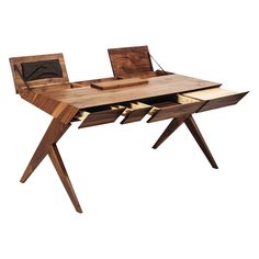 a wooden desk with drawers and a laptop on it