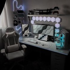 a computer desk with a chair and monitor on it