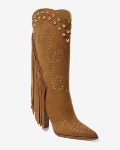 Step out into colder weather in our Fringe Studded Boot. With a luxe suede finish, bold fringe detailing, and eye-catching studded accents, this Western-inspired boot offers effortless pull-on style, making it a standout piece for your seasonal wardrobe.