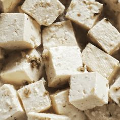 tofu cubes in a bowl with seasoning sprinkled on top