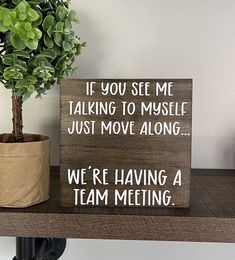 a wooden sign that says if you see me talking to muscle just move along we're having a team meeting