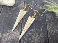 "These marbled white and gold dangle earrings feature 1/4\" wide by 1-3/8\" flat raw brass triangle/spike charms layered over 49mm x 13.5mm acrylic acetate inverted triangle charms. These earrings measure approximately 2 7/8 inches from the top of the teardrop to the bottom of the white charm, and are incredibly lightweight, weighing just 0.1 ounce combined! These earrings are available in other colors as well! The green version of these earrings is available here: https://www.etsy.com/listing/7 White Metal Plug Earrings With Ear Wire, White Brass Drop Earrings, White Metal Dangle Plug Earrings, Nickel-free White Linear Drop Earrings, White Nickel-free Drop Earrings, White Brass Earrings For Pierced Ears, White Brass Dangle Earrings, White Brass Pierced Earrings, White Brass Earrings With Ear Wire