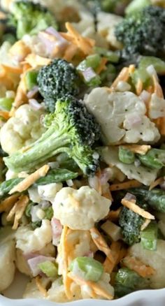 broccoli and cauliflower salad in a white bowl