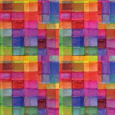 an image of a colorful quilt with squares in different colors and sizes on the fabric