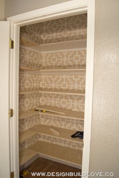 an empty closet with shelves in it