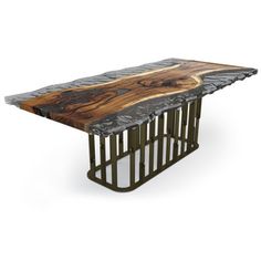 a wooden table with metal legs and a wood slab on the top that is shaped like a tree trunk