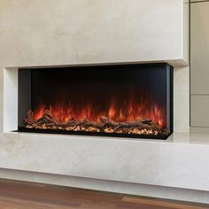 an electric fireplace in a living room with wood flooring