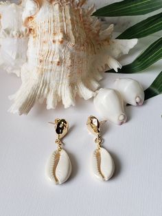 Stud earrings so chic and easy to wear. Quality gold plated brass cowries wire wrapped to a natural white cowry shell. Hangs 1.5" total. Cowry Shell, Cowrie Shell, Gold Stud, Shell Earrings, Gold Studs, Wire Wrapped, Jewelry Earrings Dangle, Hippie Boho, Etsy Earrings