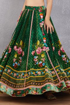 Emerald green lehenga with multi-color floral motif print, striped pattern and kamar tassel detail. Comes with plunging neck blouse and fringe border dupatta.
Component: 3
Printed
Neckline: Sweetheart
Sleeve Length: Cap
Fabric: Blouse and Lehenga: Velvet, Cotton Silk; Lehenga: Dupion; Dupatta: Net and Cotton Silk
Color: Green
Kamar latkans
Tie-up back
Fringe dupatta - Aza Fashions Fringe Dupatta, Emerald Green Lehenga, Lehenga Velvet, Velvet Embroidery, Green Lehenga, Plunging Neck, Silk Lehenga, Green Blouse, Bridal Set