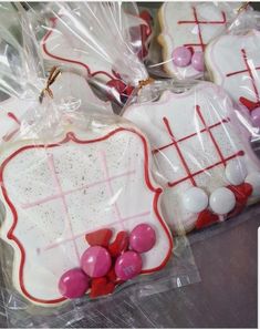 some decorated cookies in plastic bags on a table