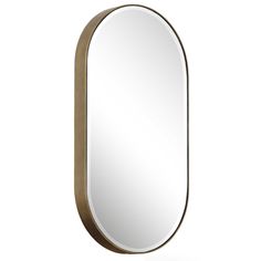 an oval shaped mirror with a gold frame and metal trim on the bottom, against a white background