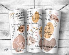 three personalized tumbles with flowers and words on them, sitting next to each other