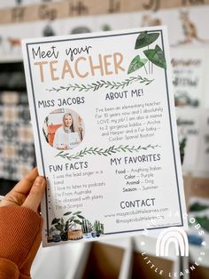 a person holding up a poster with the words meet your teacher