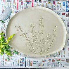 a white platter with flowers on it