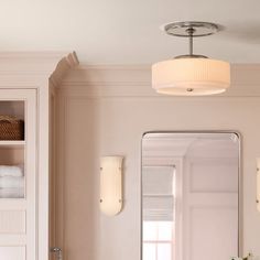 the bathroom is clean and ready to be used as a light fixture for the vanity