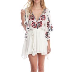 Take A Walk On The Wild Side With The Free People Cora White Embroidered Dress! Intricate Navy Blue, Red, And Beige Embroidery Decorates This Flirty Woven Dress With A Scalloped, Plunging Neckline And Wide, Fluttering Sleeves With Side Slits. Elastic Waistband, And An Tasseled, Wrap Belt Tops A Leg-Baring Mini Skirt. Skirt Is Lined. 100% Viscose. Machine Wash Cold. Imported. Embroidered V-neck Vacation Dress, Bohemian V-neck Embroidered Dress For Brunch, V-neck Dresses With Embroidered Hem For Brunch, White V-neck Embroidered Dress For Festival, Flowy V-neck Embroidered Dress, Folk Style V-neck Dress For Vacation, Summer Embroidered V-neck Boho Dress, Beach Cover-up Dress With Floral Embroidery And Short Sleeves, Floral Embroidery Short Sleeve Beach Cover-up Dress