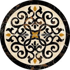 an ornate design in black and white marble with gold accents on the center is shown