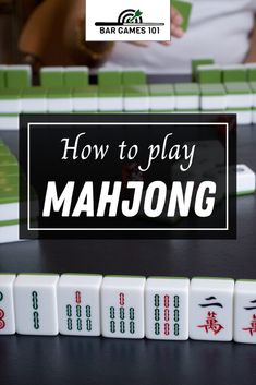 the words how to play mahjong are in front of some dices