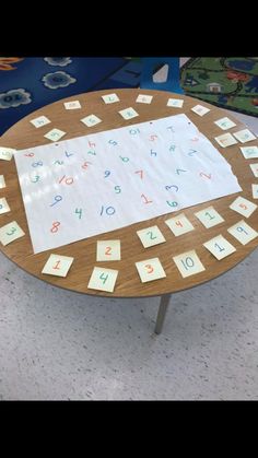 a wooden table topped with lots of letters and numbers