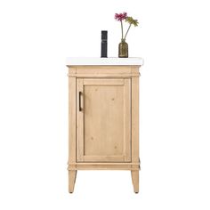 a wooden cabinet with a white counter top and flowers in a vase next to it