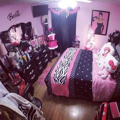 a bedroom decorated in pink, black and white