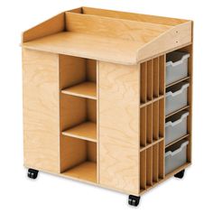 a wooden storage unit with six bins and two shelves on wheels, one is empty