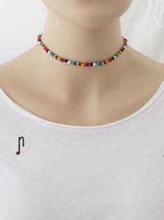 "This Multicolor Seed Bead choker is great for summer and in the beach. It is made with small seed beads. This Seed Beaded Choker can be perfect to wear everyday. This listing for one choker. Three color versions of the choker are available. Primary photo shows the choker version 2. DETAILS - Japanese glass seed beads 4 mm - Quality strong nylon string - Choker length. Choose in the drop down menu - Lobster or round clasp closure. Available gold tone (default) or silver tone (by request) - Exten Choker Simple, Teen Necklaces, Colorful Choker, Rainbow Choker, Handmade Choker Necklace, Seed Bead Choker, Red Can, Jewelry Hippie, Handmade Chokers