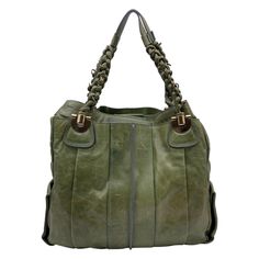 Gorgeous CHLOE 'Heloise Bag ' crafted in genuine leather in green color. Braided handles. Gold metal hardware. Magnetic button closure. The interior is done in a beige canvas textile and includes a side zipper pocket and 1 open pocket inside. 'Chloe' signature engraved inside Condition B - VERY GOOD Gently used. Some normal wear of use on leather. Some light wear of use on bottom corners. Please check the photos carefully and ask if you need to know more details or if you have any doubts. Details MATERIAL: Leather COLOR: Green MODEL: Heloise GENDER: Women COUNTRY OF MANUFACTURE: Italy SIZE: Medium FABRIC TYPE: Leather MATERIAL PROCESSING: n.a. MATERIAL EFFECT: n.a. ALL APPLIQUE: n.a. HANDLE STYLE: Double Handles DESIGN: Solid colour BAGS HANDLES: Double handle BAGS SHOULDER STRAP: n.a. BAG Designer Satchel With Braided Handles, Designer Leather Bags With Braided Handles, Designer Handheld Bags With Braided Handles, Luxury Green Soft Leather Bag, Designer Green Leather Shoulder Bag, Luxury Green Soft Leather Shoulder Bag, Luxury Green Soft Leather Hobo Bag, Luxury Green Shoulder Bag For Everyday, Luxury Shoulder Bag With Braided Handles For Daily Use