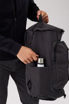 From the office to the gym—and personal item to carry-on—this reinforced canvas backpack seamlessly transforms into a spacious duffle. It features a dedicated shoe compartment, a padded laptop sleeve, and accessible pockets (for your most reached-for items). Mack Weldon offers the best and most comfortable premium clothing for anything from working out to casual living. Our incredibly soft and smooth fabric will change your outlook on men's clothing. Come see why we are the one of the top luxury Everyday Duffle Bag Backpack With Functional Pockets, Functional Sports Duffle Bag Backpack, Functional Backpack With Luggage Sleeve For Outdoor Activities, Functional Everyday Backpack With Luggage Sleeve, Everyday Functional Backpack With Luggage Sleeve, Functional Backpack With Luggage Sleeve, Functional Canvas Travel Backpack, Sporty Travel Bag With Functional Pockets, Functional Canvas Gym Bag For Travel