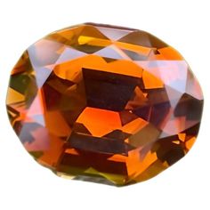 an orange and brown diamond on a white background