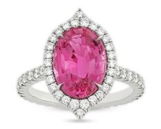 an oval shaped pink sapphire and diamond ring